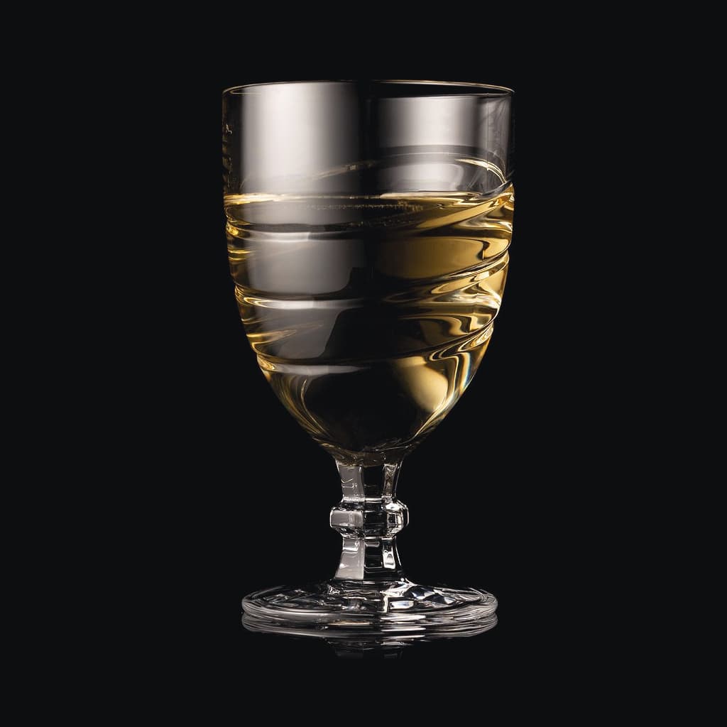 SHTOX Tempest wine glass with white wine, on black